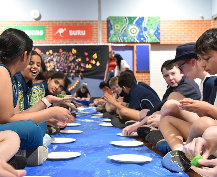 A group of students doing Diwali day craft activities