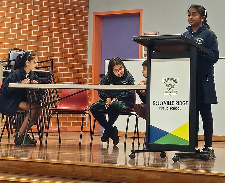 Students participating in a debating challenge
